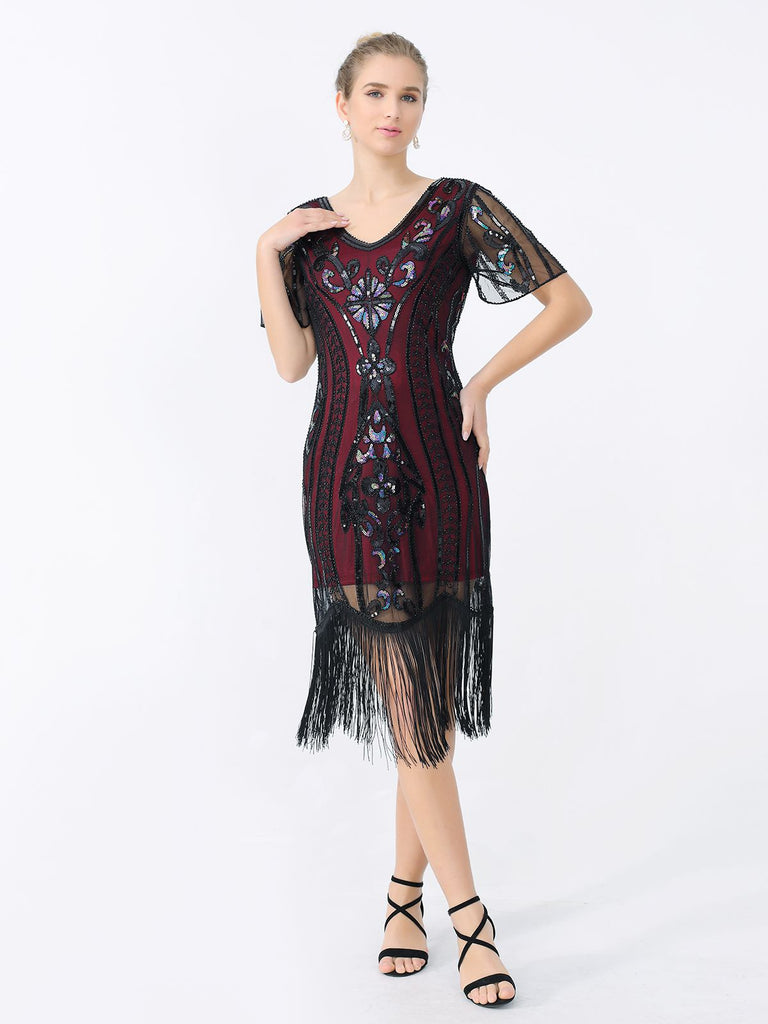 This 1920s Fringe Sequin Flapper Dress wraps her in 1920s elegance, one twirl at a time