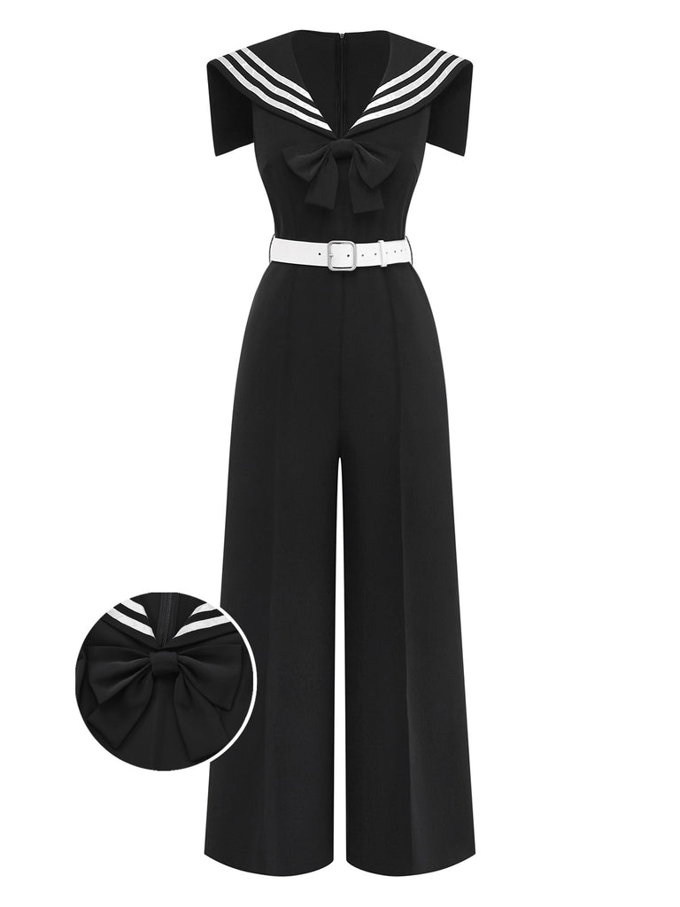 Black jumpsuit with white trim and bow detail on a white background