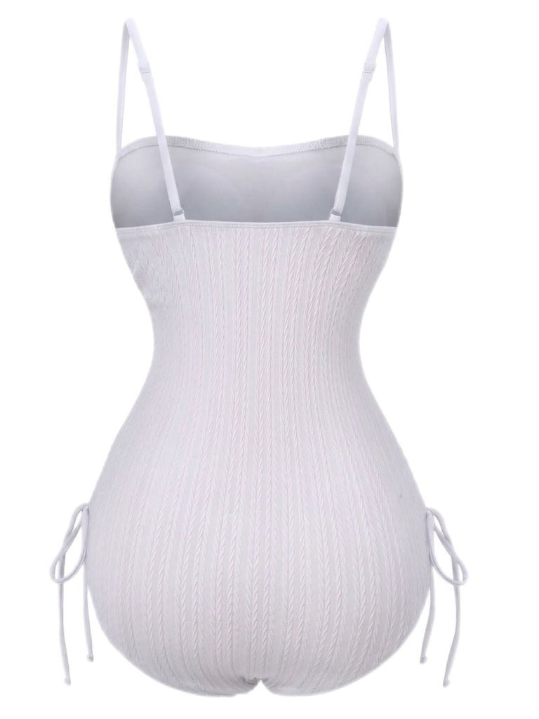 White ribbed bodysuit with thin straps on a white background
