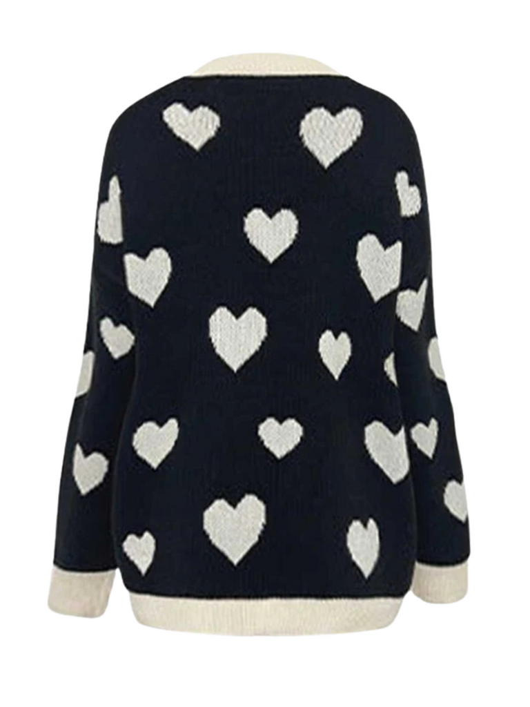This 1950s Button Heart Dot Knitted Cardigan whispers 1950s secrets to those who notice