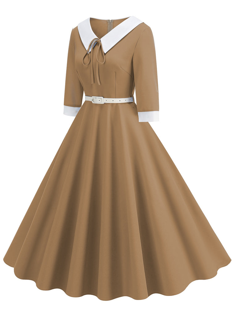 This 1950s Contrast Tie Neck Belted Lapel Dress wraps her in 1950s elegance, one twirl at a time
