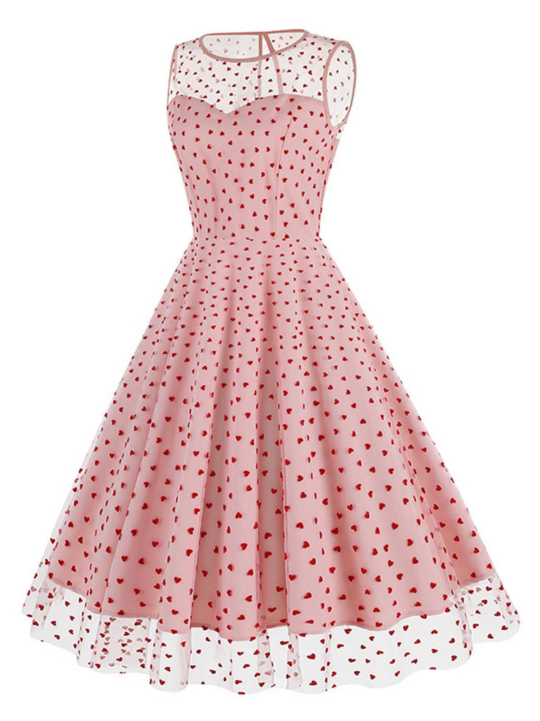 She slips into this 1950s Flocked Heart Mesh Patchwork Dress and suddenly it's a 1950s daydream