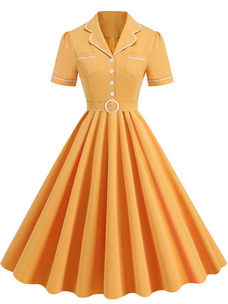 She slips into this 1950s Lapel Belted Solid Dress and suddenly it's a 1950s daydream
