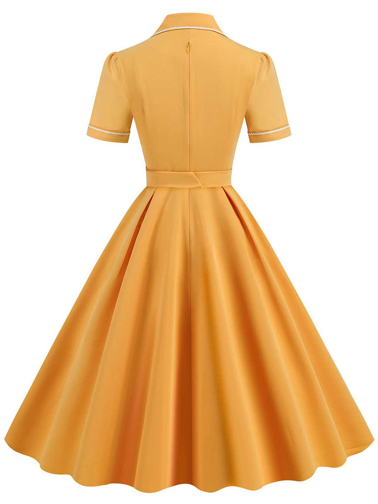 This 1950s Lapel Belted Solid Dress wraps her in 1950s elegance, one twirl at a time