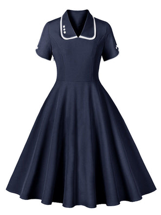 She slips into this 1950s Lapel Buttoned Short Sleeve Solid Dress and suddenly it's a 1950s daydream