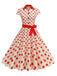 This 1950s Lapel Polka Dots Bow Swing Dress wraps her in 1950s elegance, one twirl at a time