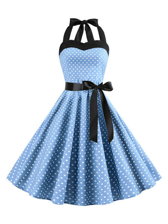 She slips into this 1950s Polka Dot Bow Tie Halter Swing Dress and suddenly it's a 1950s daydream
