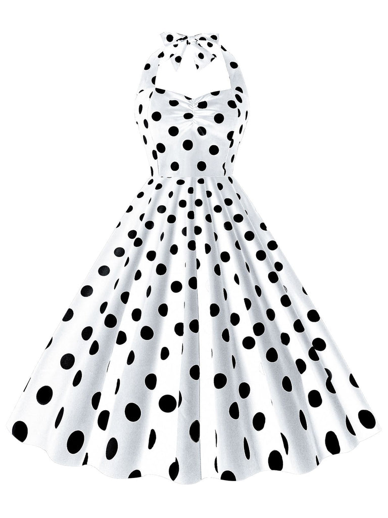 She slips into this 1950s Polka Dot Halter Swing Dress and suddenly it's a 1950s daydream