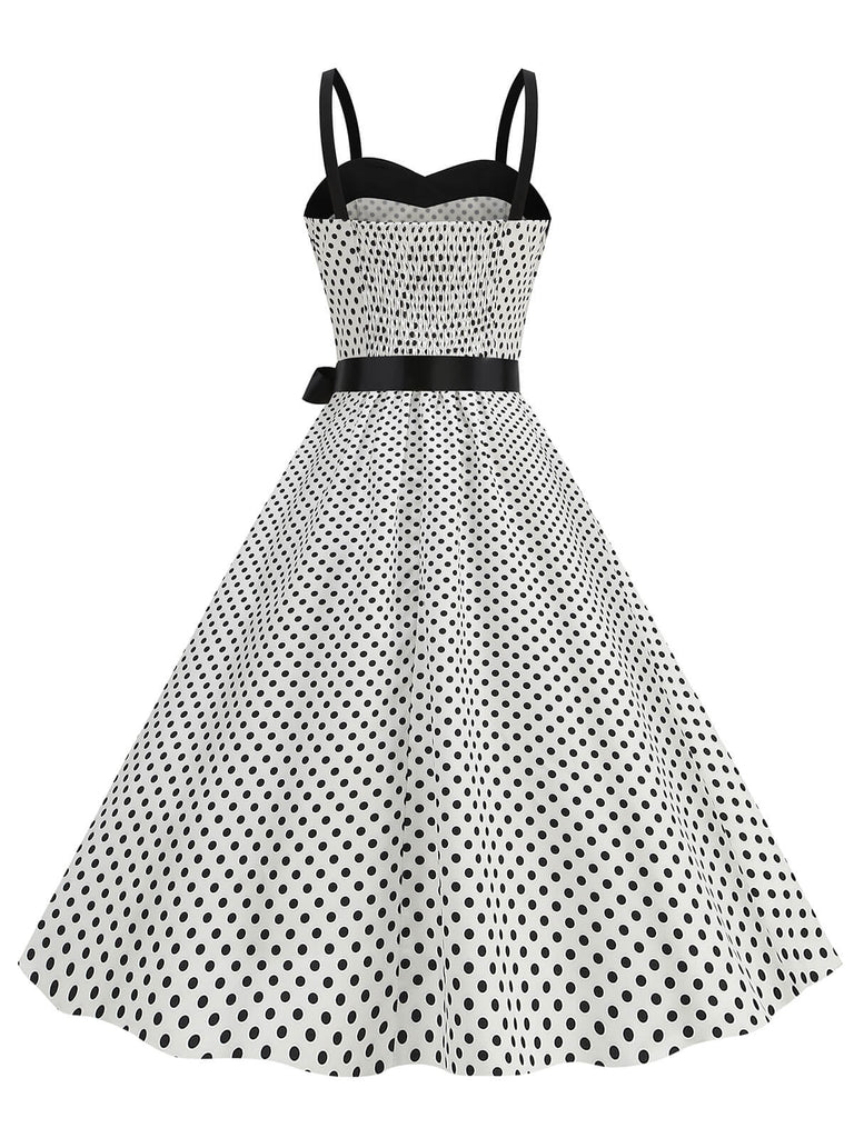 She slips into this 1950s Polka Dots Patchwork Ribbon Strap Dress and suddenly it's a 1950s daydream