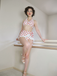 She's wearing 1950s Retro Polka Dots Bikini Set & Apron and the whole beach remembers the 1950s
