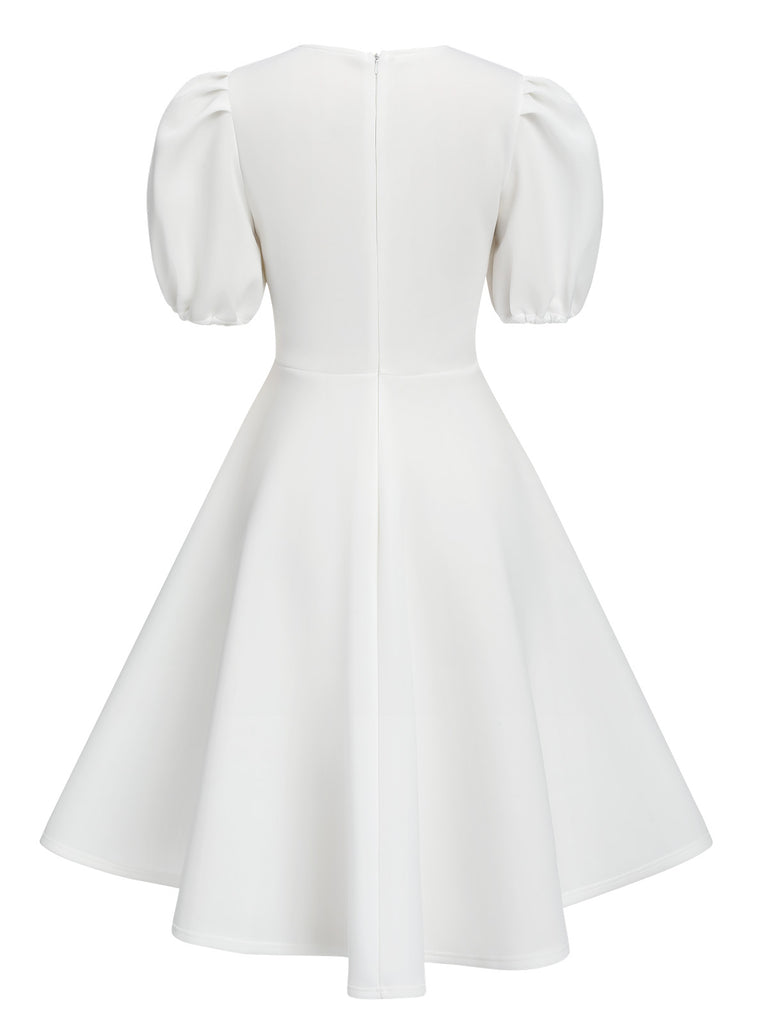 This 1950s Round Neck Puff Sleeve A-Line Dress wraps her in 1950s elegance, one twirl at a time