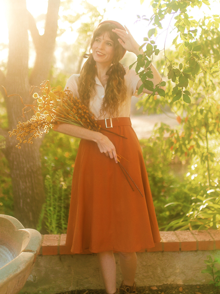 She slips into this 1950s Snow Style Button Dress and suddenly it's a 1950s daydream