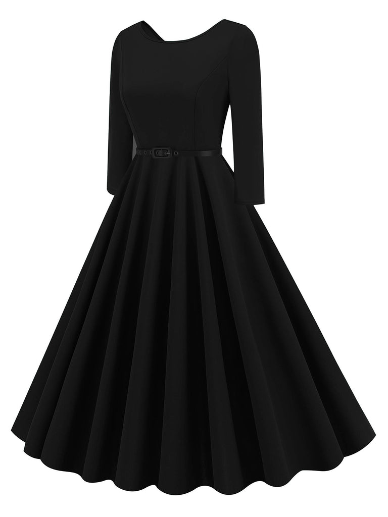 She slips into this 1950s Solid Belted Swing Dress and suddenly it's a 1950s daydream