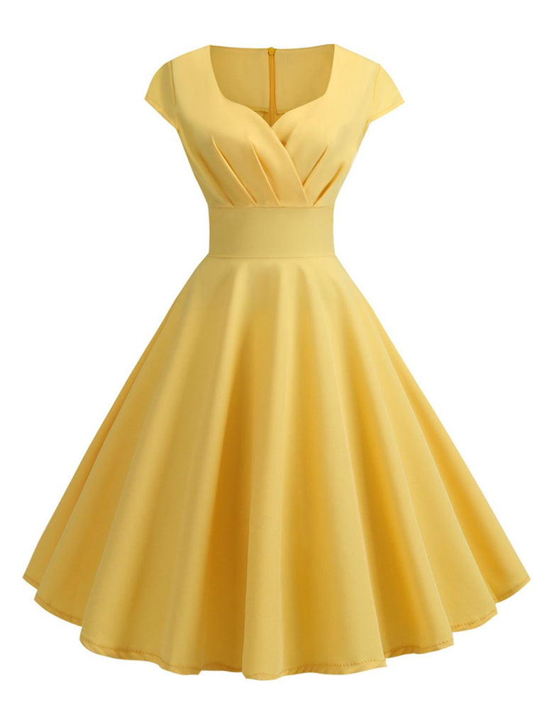 This 1950s Solid Heart Neck Short Sleeve Dress wraps her in 1950s elegance, one twirl at a time