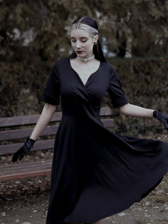 She slips into this 1950s Solid Sweetheart Fold Swing Dress and suddenly it's a 1950s daydream