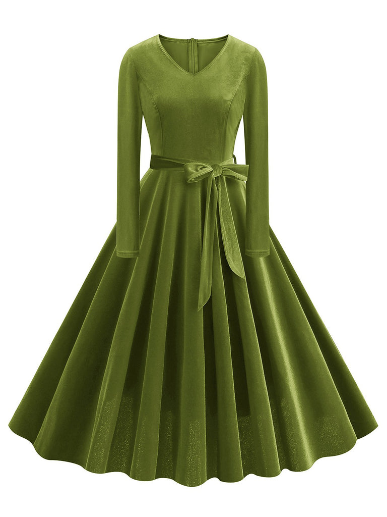 She slips into this 1950s Solid Velvet V-Neck Swing Dress and suddenly it's a 1950s daydream