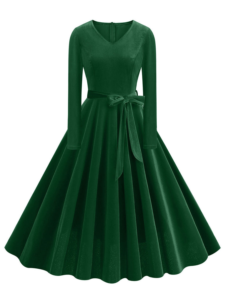 She slips into this 1950s Solid Velvet V-Neck Swing Dress and suddenly it's a 1950s daydream