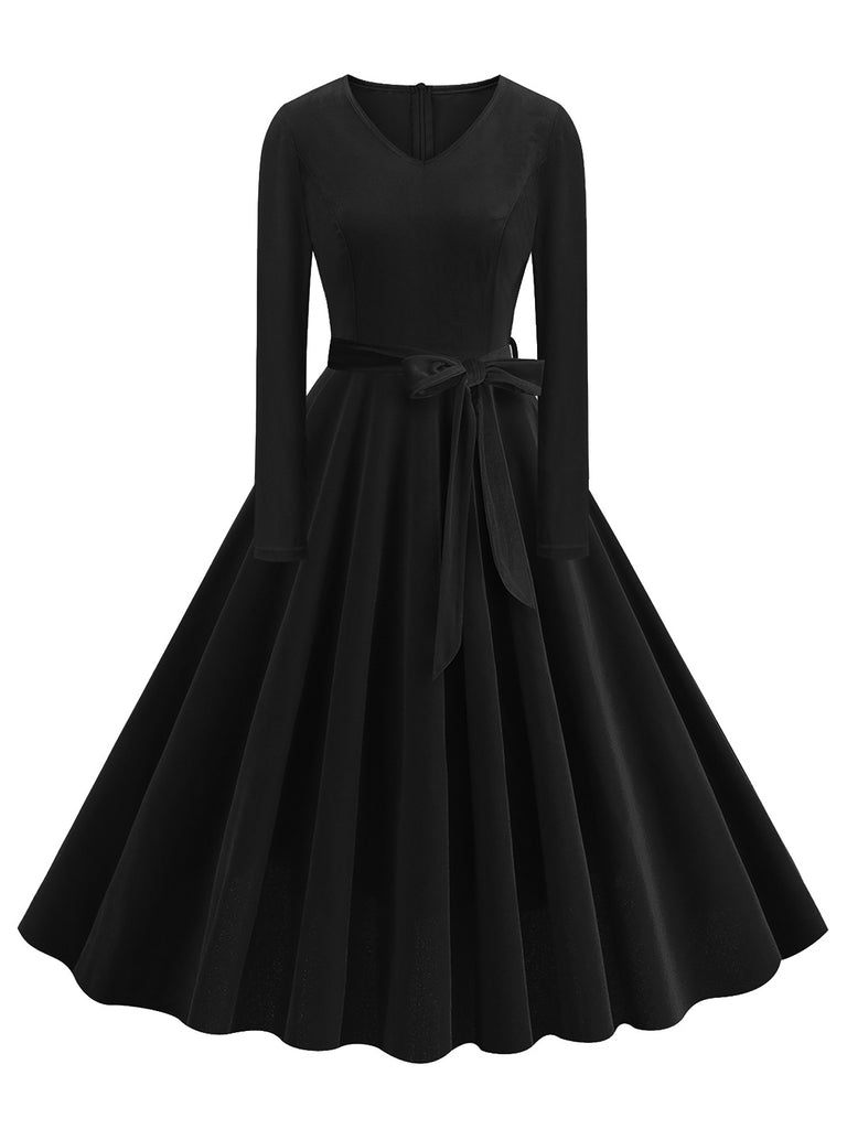 She slips into this 1950s Solid Velvet V-Neck Swing Dress and suddenly it's a 1950s daydream