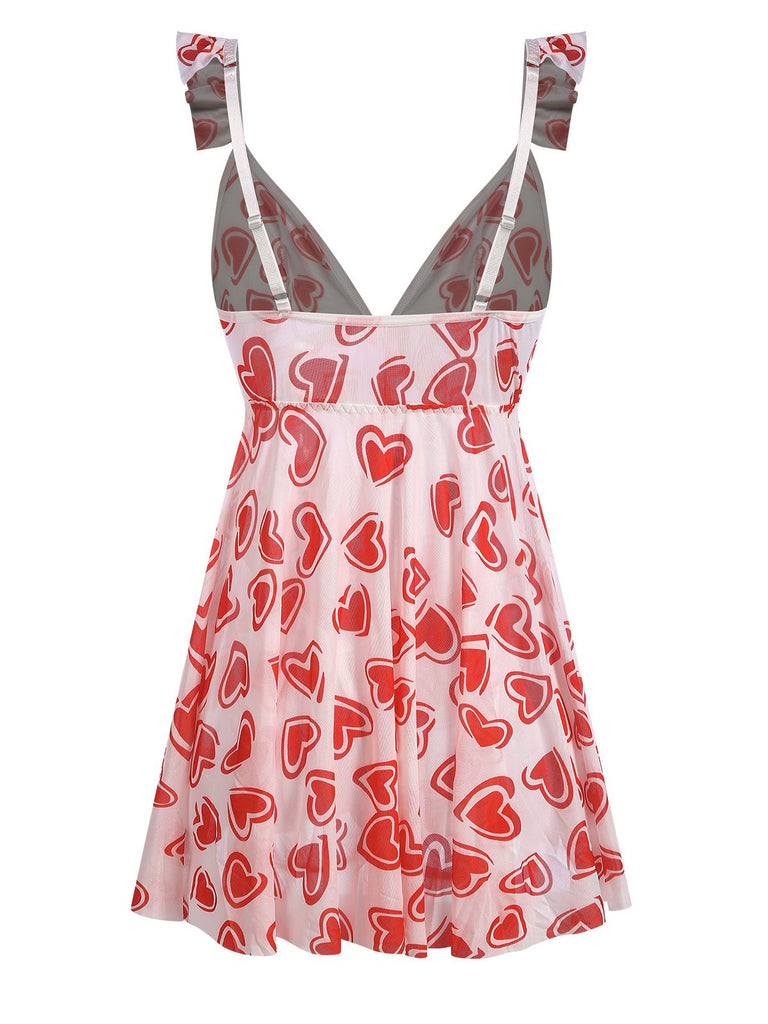 This 1950s Spaghetti Strap Heart Ruffles Mini Nightgown wraps her in 1950s elegance, one twirl at a time