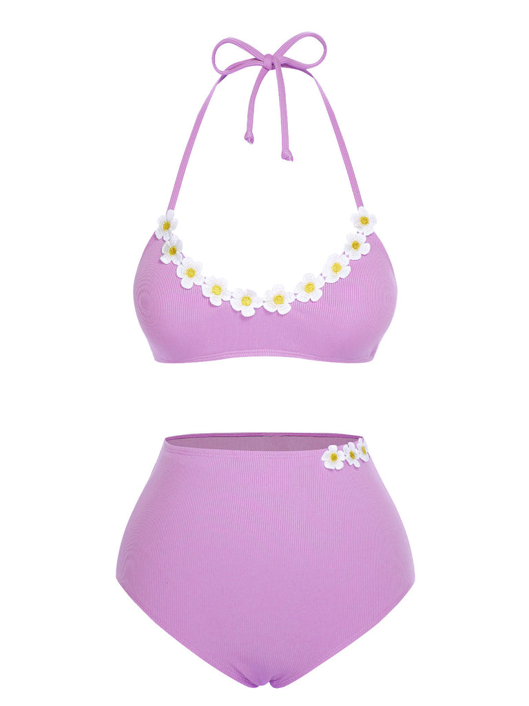 She's wearing 1960s Halter Knit Daisy Swimsuit and the whole beach remembers the 1960s