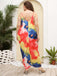 This 1960s Spaghetti Strap Floral Tulip Dress wraps her in 1960s elegance, one twirl at a time
