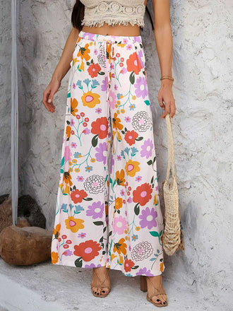She walks in these 1960s Vintage Colorful Print Wide-Leg Pants and the world follows