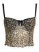 She pairs this 1980s Leopard Bow Crop Camisole with confidence and 1980s charm