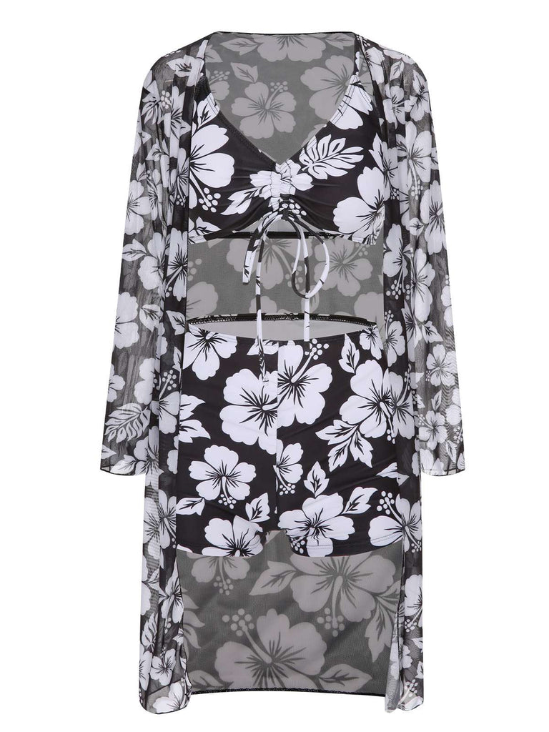 She's wearing 3PCS Black 1950s Flowers Swimsuit & Cover-Up and the whole beach remembers the 1950s