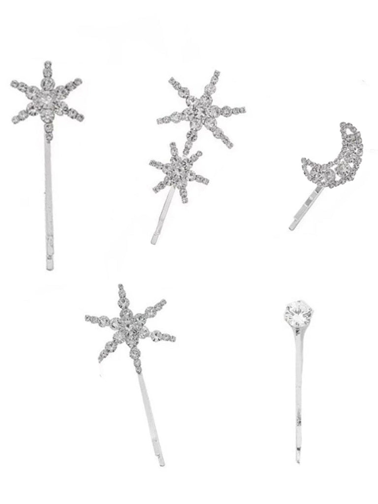 Set of silver hairpins with star and moon designs on a white background