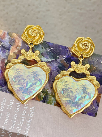 She adds this Alloy Rose Reflective Pleated Heart Earrings and suddenly it's vintage perfection