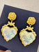 This Alloy Rose Reflective Pleated Heart Earrings carries vintage stories waiting to be told