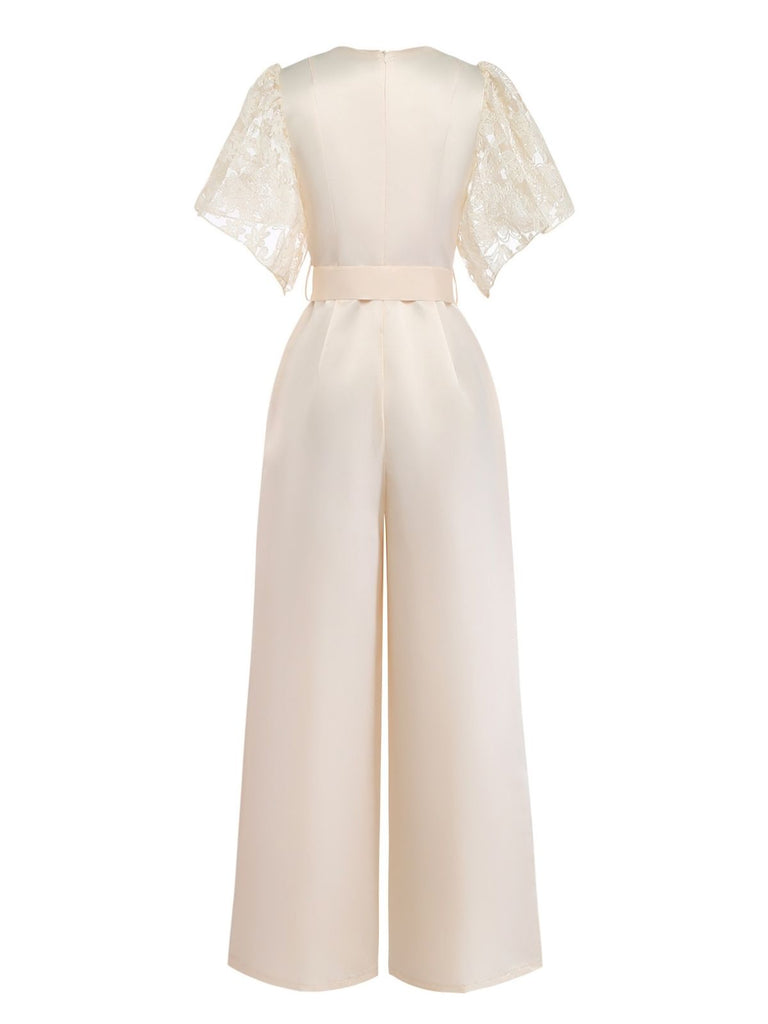 Beige jumpsuit with lace sleeves on a white background