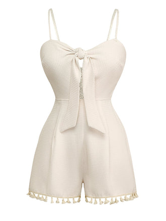 She finds her 1950s story in this Beige 1950s Solid Spaghetti Straps Smocked Romper