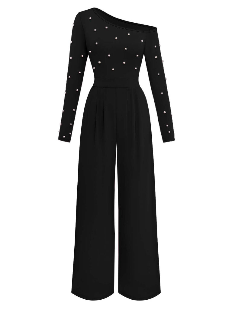 Black jumpsuit with pearl embellishments on a white background