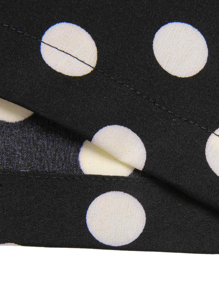 This Black 1940s Polka Dots Cross Halter Jumpsuit whispers 1940s secrets to those who notice