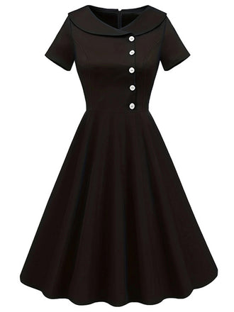 She slips into this Black 1940s Solid Buttoned Lapel Dress and suddenly it's a 1940s daydream