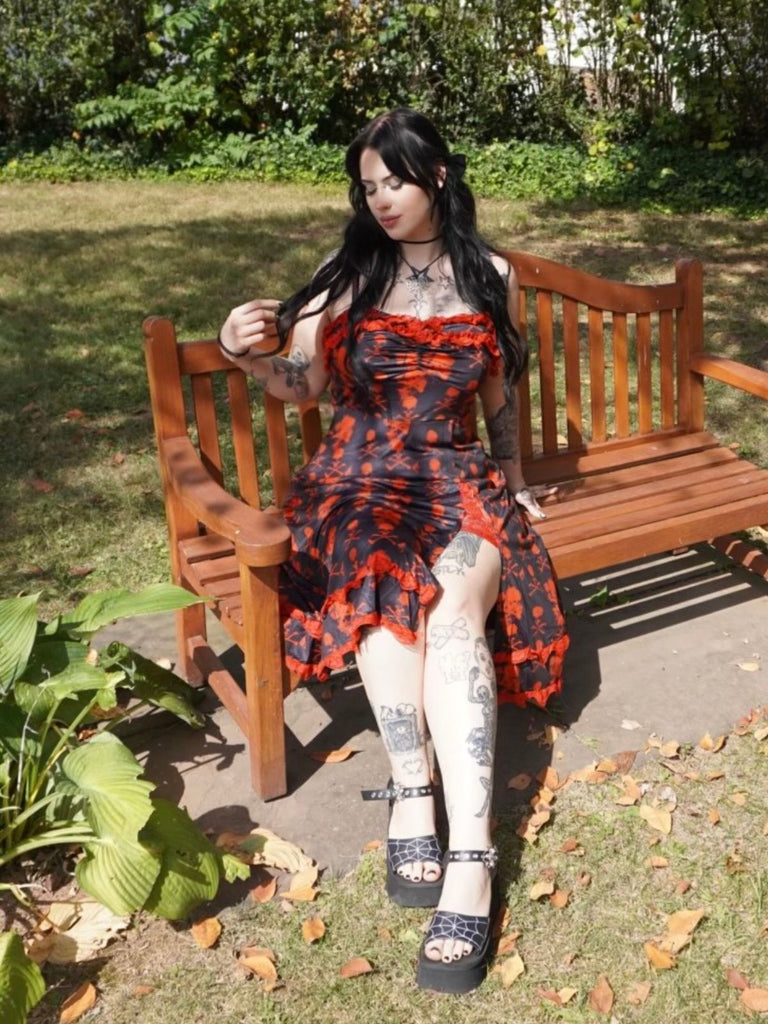 She slips into this Black 1950s Skull Lace Strap Dress and suddenly it's a 1950s daydream