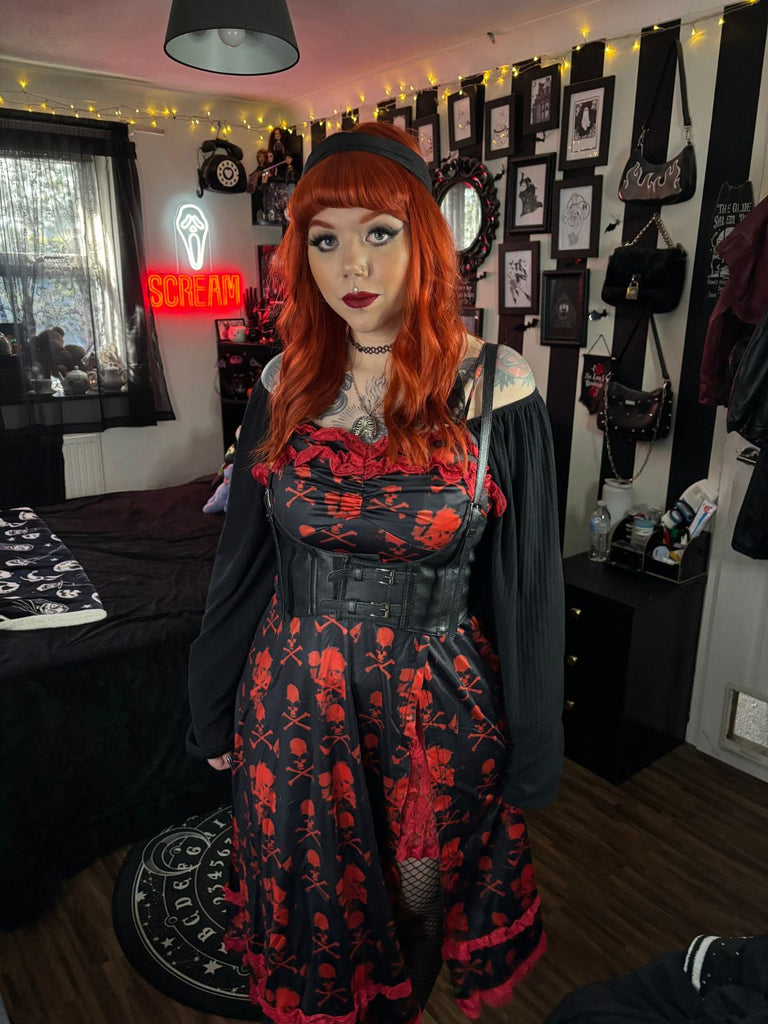 She slips into this Black 1950s Skull Lace Strap Dress and suddenly it's a 1950s daydream