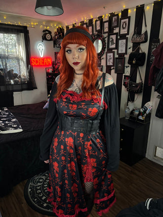 She slips into this Black 1950s Skull Lace Strap Dress and suddenly it's a 1950s daydream