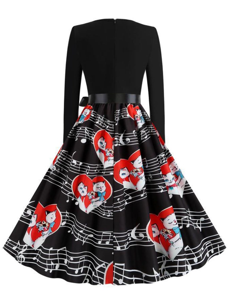 This Black 1950s Valentine Cats & Music Note Patchwork Dress wraps her in 1950s elegance, one twirl at a time