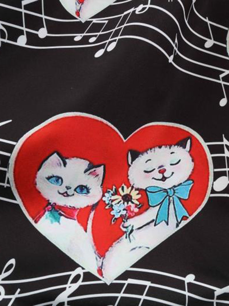 Black 1950s Valentine Cats & Music Note Patchwork Dress — the kind of 1950s dress that makes strangers smile