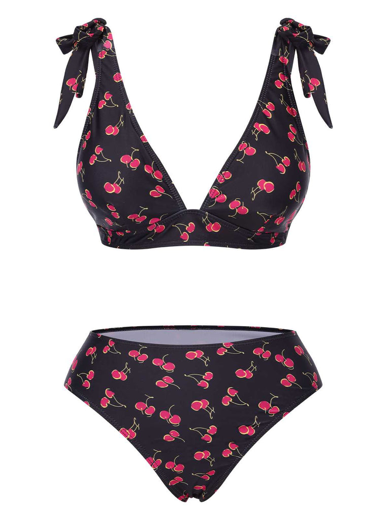 She's wearing Black 1960s Tie Strap Cherry Swimsuit and the whole beach remembers the 1960s