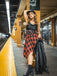 She slips into this Black 1970s Plaid Cowl Neck Dress and suddenly it's a 1970s daydream