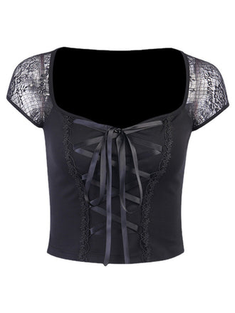 She pairs this Black 1970s Steampunk Gothic Lace Tie-Front Top with confidence and 1970s charm