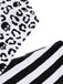 Black 1980s One-Shoulder Hollow Skull Stripe Swimsuit — 1980s poolside glamour meets sun-drenched confidence
