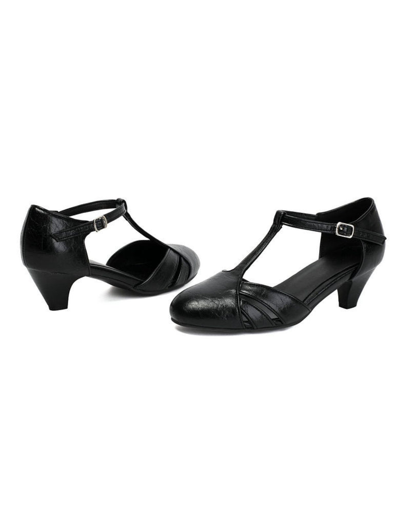 Pair of black ballroom dancing shoes on a white background