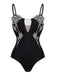Black swimsuit with floral embellishments on a white background