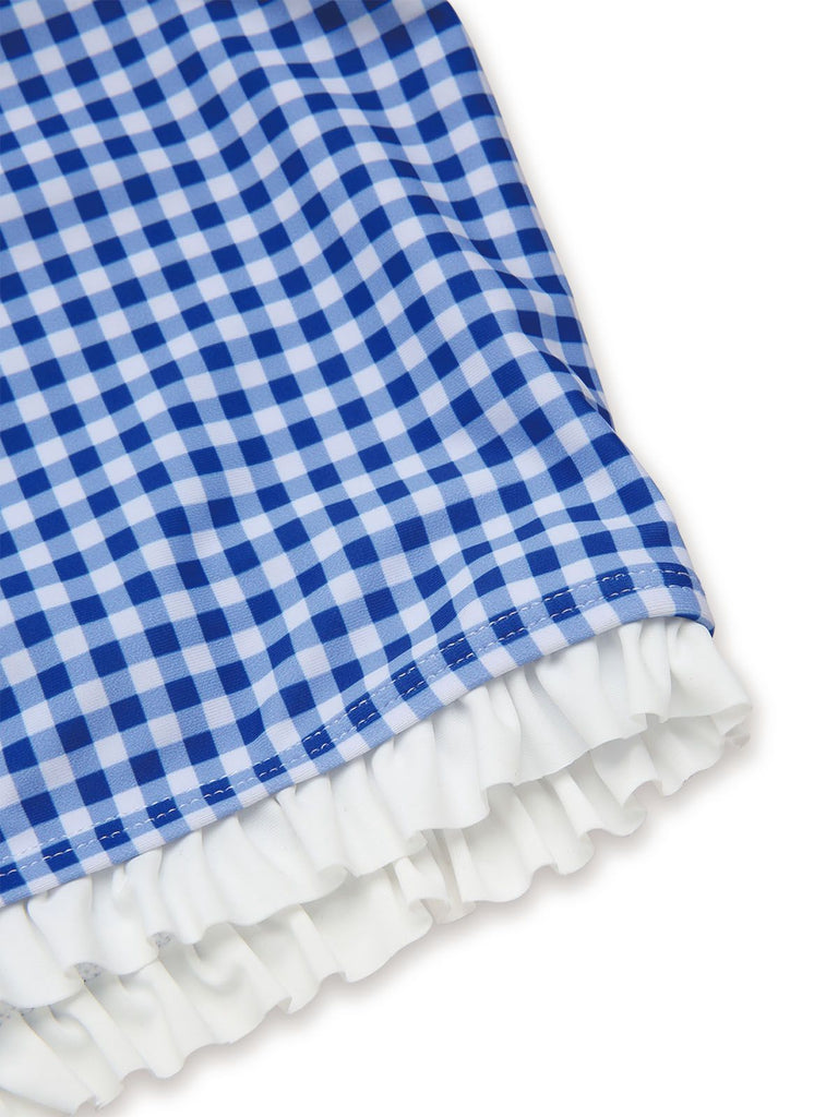 Blue and white checkered fabric with ruffled edge on a white background
