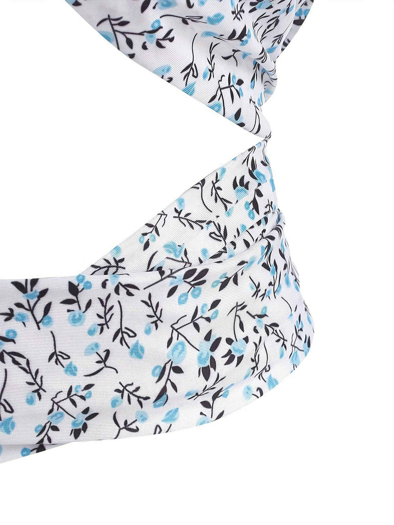 This Blue 1950s Ditsy Floral Lace-Up Crop Camisole brings 1950s soul to her everyday