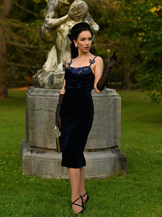 She slips into this Blue 1960s 3D Butterfly Velvet Pencil Dress and suddenly it's a 1960s daydream